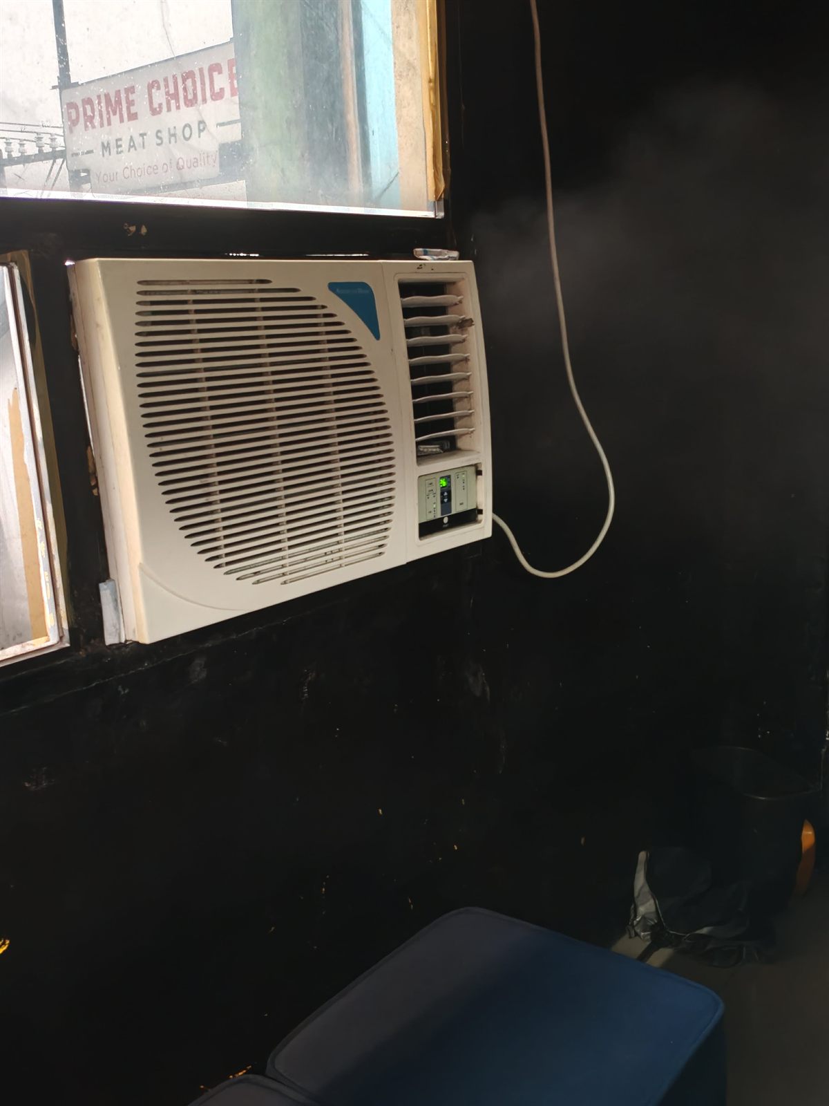 Window air-conditioning unit on the gym floor